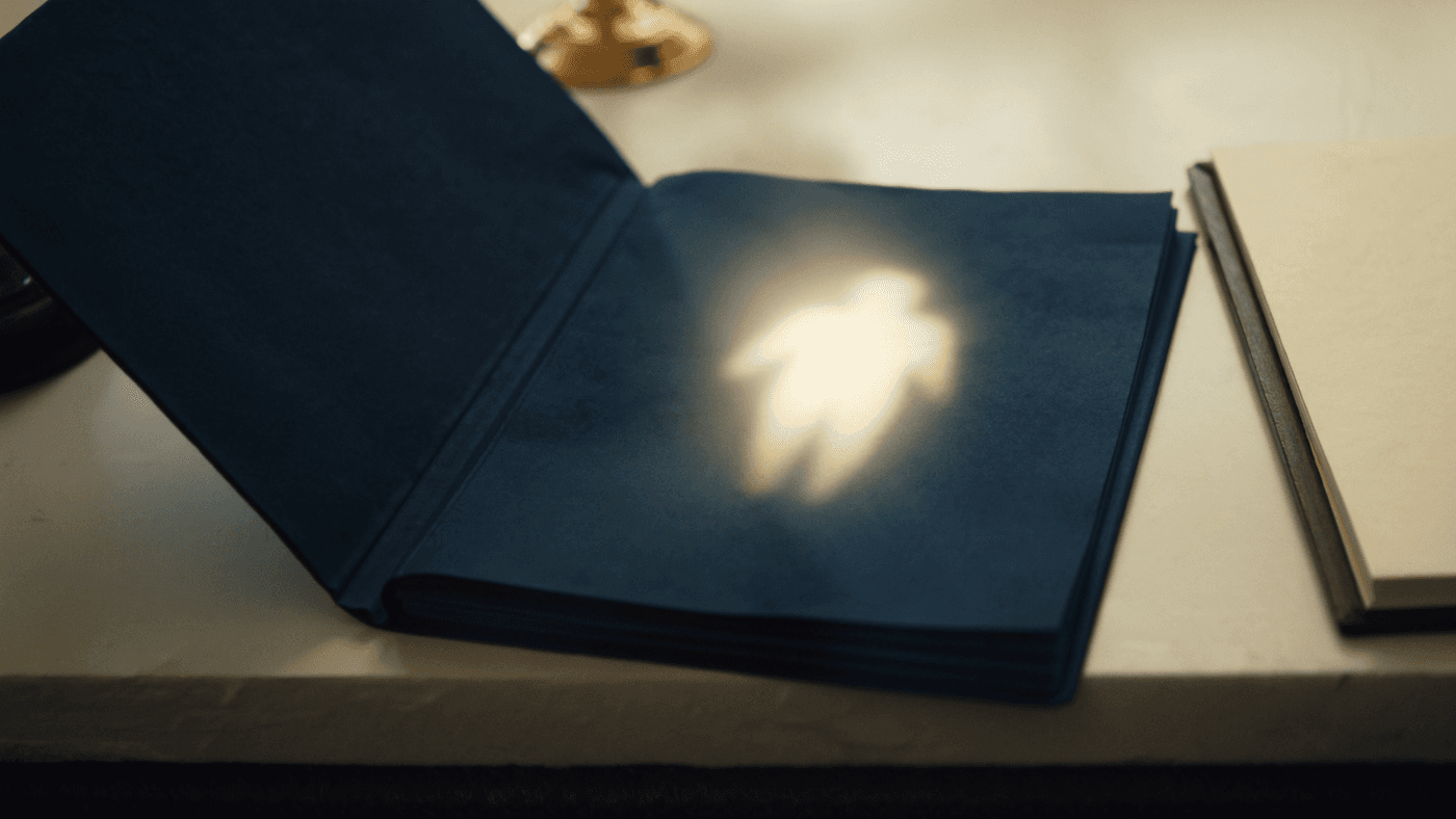 Legal file opening to reveal a warm human silhouette behind the matter